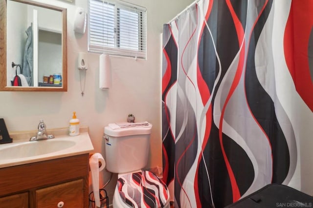 bathroom with walk in shower and vanity