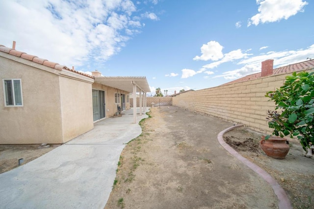 view of yard featuring a pergola and a patio