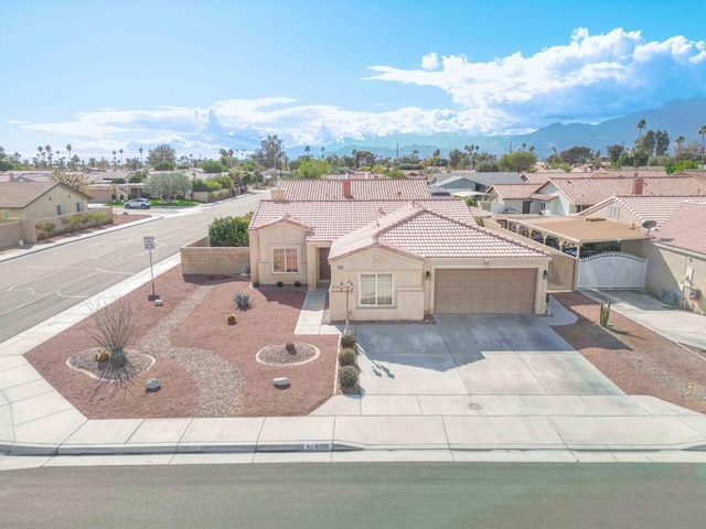 birds eye view of property featuring a mountain view