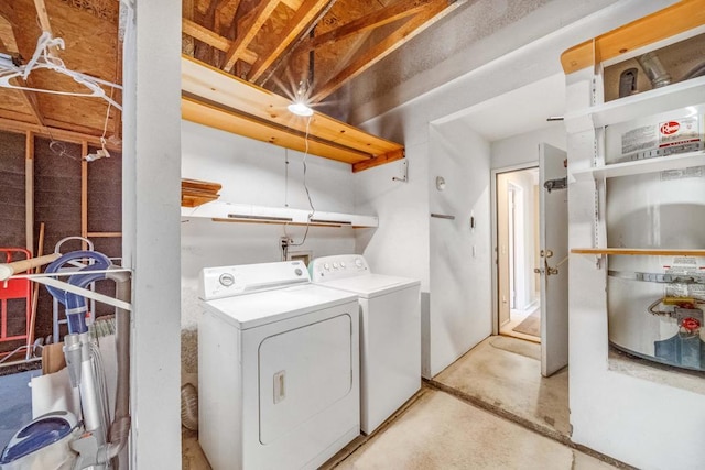 laundry area featuring washing machine and clothes dryer