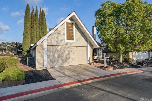 front facade featuring a garage and central air condition unit