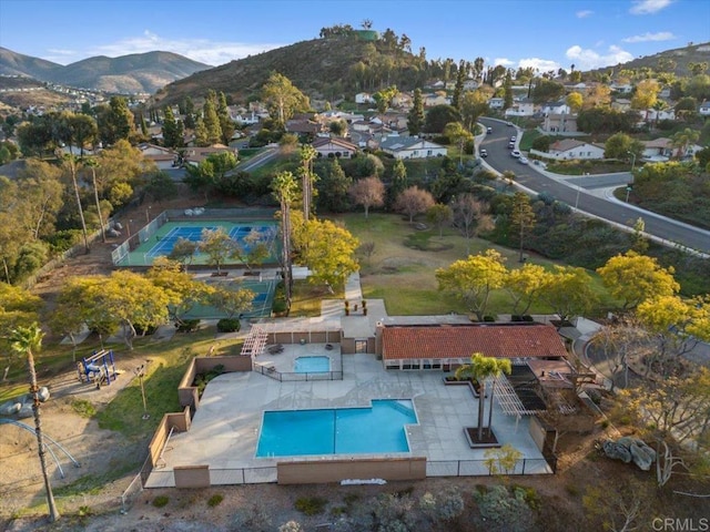 birds eye view of property featuring a mountain view