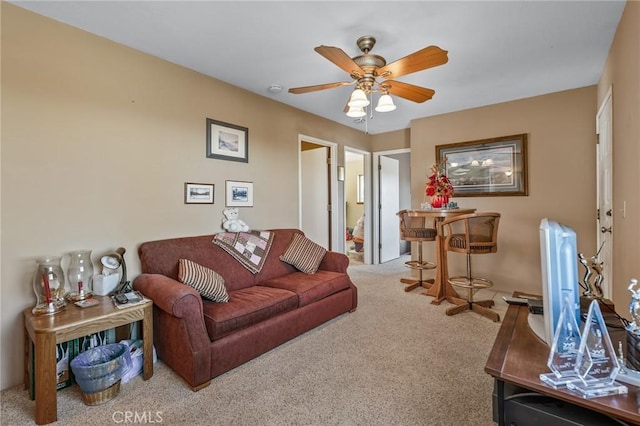 living room with carpet floors and ceiling fan