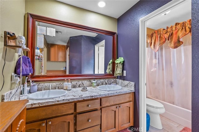 full bathroom featuring shower / bath combination with curtain, vanity, toilet, and tile patterned flooring