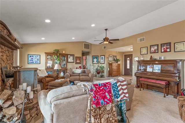 living room featuring lofted ceiling, light colored carpet, and ceiling fan