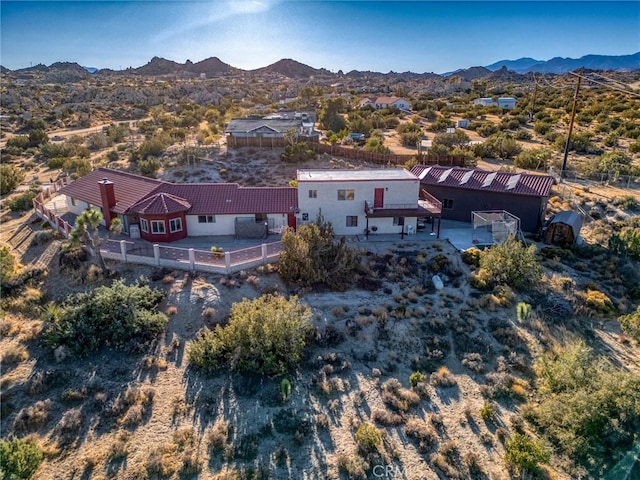 birds eye view of property with a mountain view