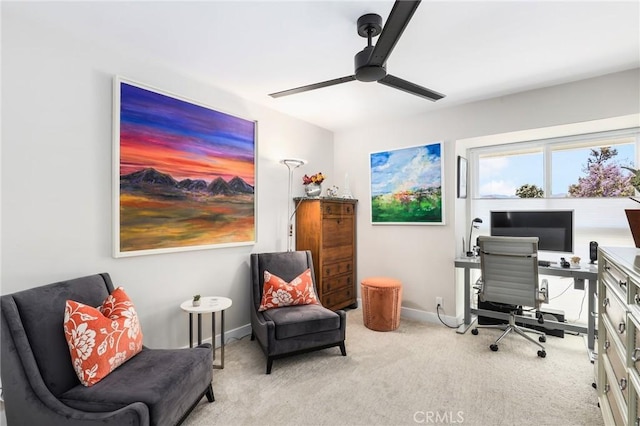 carpeted home office with ceiling fan