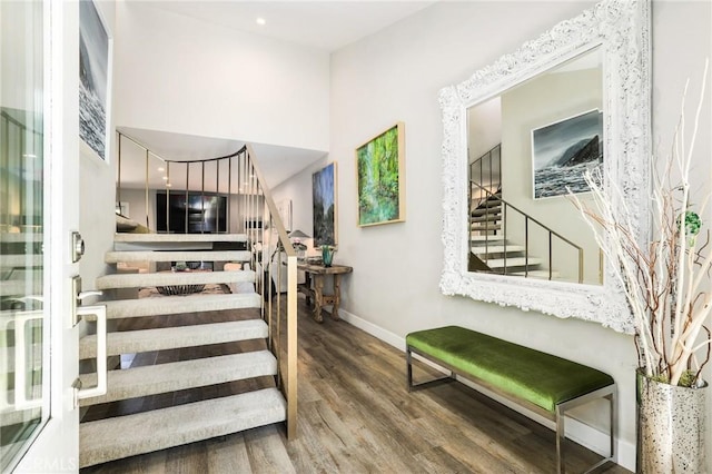 stairs featuring hardwood / wood-style flooring