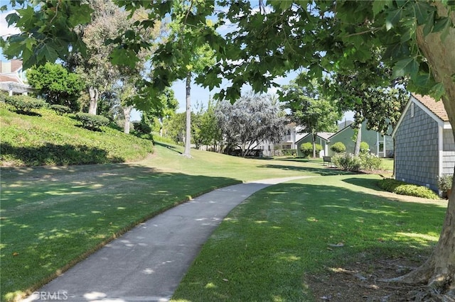 view of home's community featuring a lawn