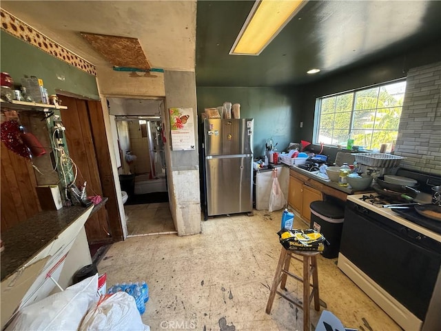 kitchen featuring stainless steel refrigerator and stove