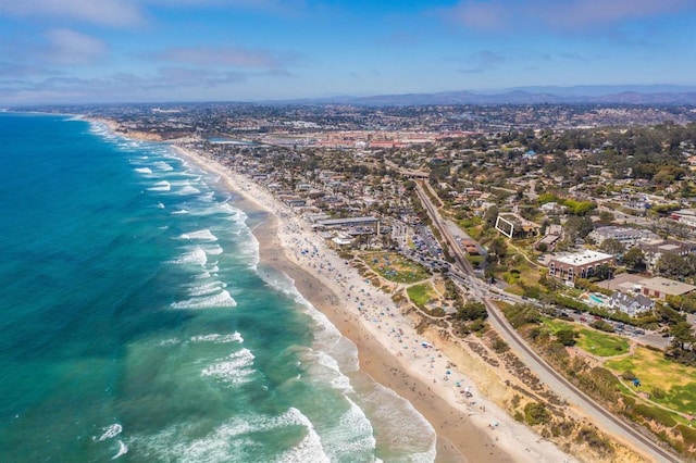 bird's eye view featuring a view of the beach and a water view