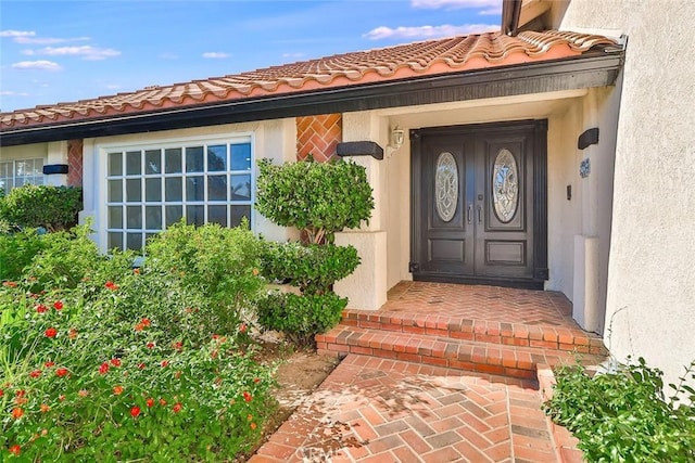 20591 Celtic St, Chatsworth, CA 91311 - property entrance with a tile roof and stucco siding