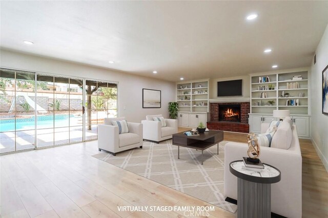20591 Celtic St, Chatsworth, CA 91311 - living area featuring a fireplace, wood finished floors, recessed lighting, and built in features