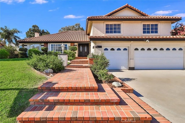20591 Celtic St, Chatsworth, CA 91311 - view of front of home featuring concrete driveway, a front yard, stucco siding, and a tiled roof