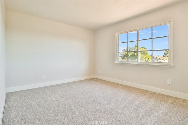 20591 Celtic St, Chatsworth, CA 91311 - carpeted empty room with baseboards