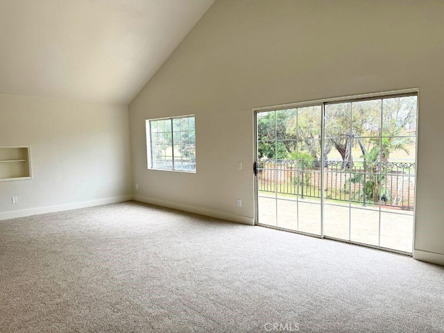 20591 Celtic St, Chatsworth, CA 91311 - spare room featuring baseboards, high vaulted ceiling, and carpet floors