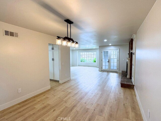 20591 Celtic St, Chatsworth, CA 91311 - unfurnished dining area featuring visible vents, light wood-style floors, baseboards, recessed lighting, and a fireplace