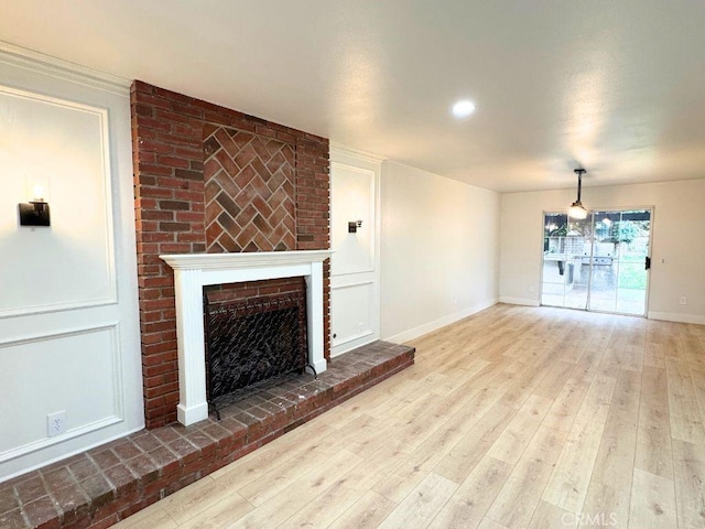 20591 Celtic St, Chatsworth, CA 91311 - unfurnished living room featuring baseboards, recessed lighting, wood finished floors, and a fireplace
