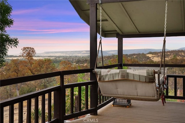 deck at dusk with a mountain view