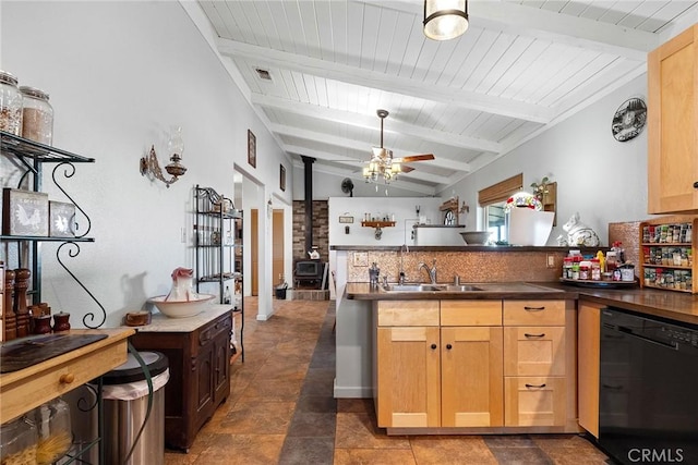 kitchen with sink, vaulted ceiling with beams, black dishwasher, kitchen peninsula, and ceiling fan