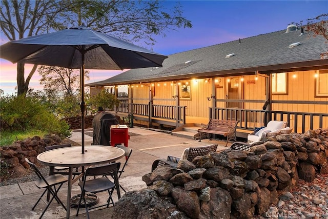 patio terrace at dusk with area for grilling