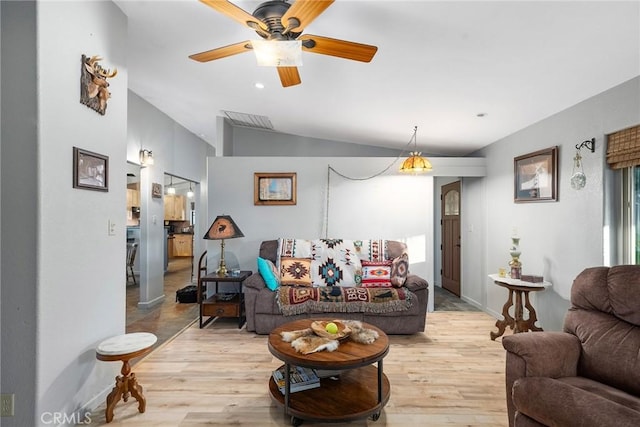 living room with lofted ceiling, a wealth of natural light, light hardwood / wood-style flooring, and ceiling fan