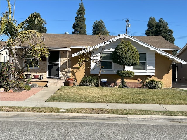 bungalow with a front lawn