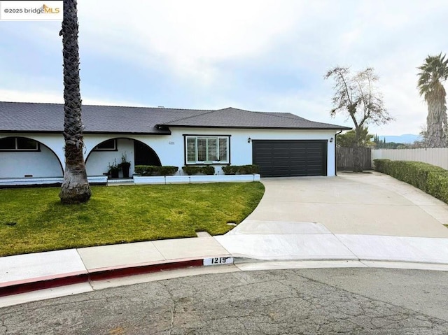 single story home with a garage and a front yard