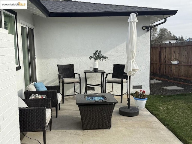 view of patio / terrace featuring a fire pit