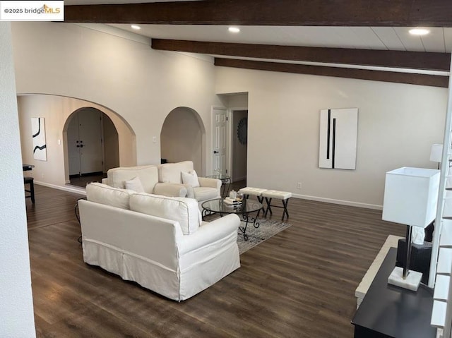 living room featuring dark wood-type flooring and lofted ceiling with beams