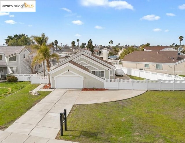 view of front of house featuring a garage and a front yard