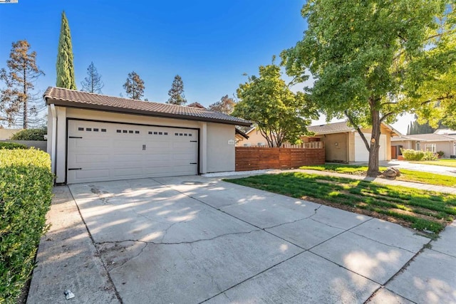 ranch-style home featuring a garage