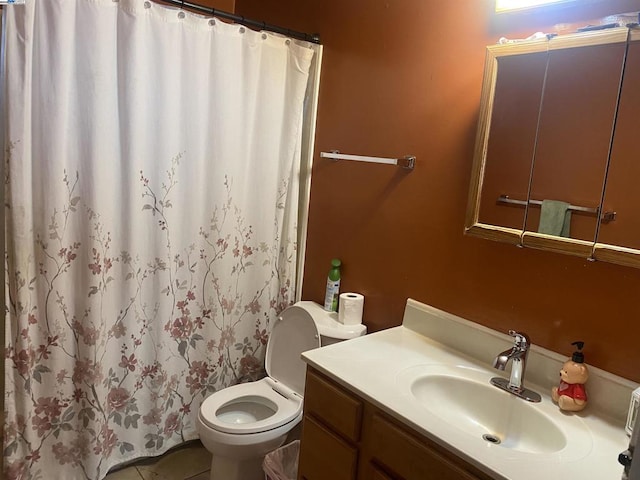 bathroom with tile patterned flooring, vanity, curtained shower, and toilet