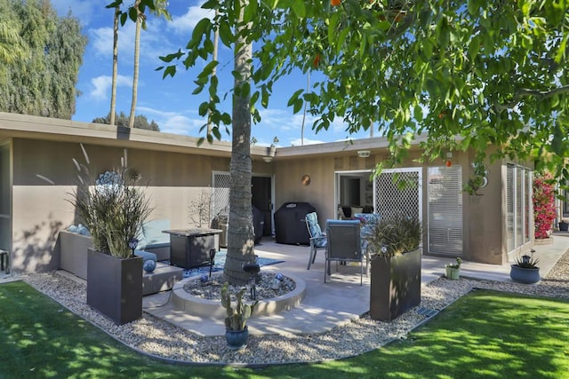 rear view of house with a patio area