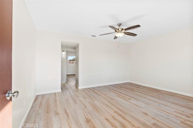 unfurnished room with light hardwood / wood-style flooring and ceiling fan