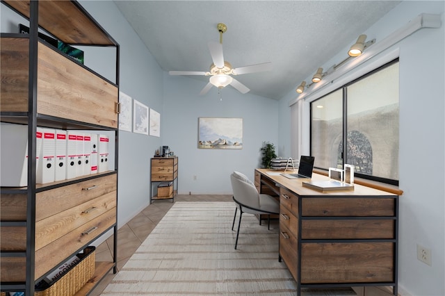 tiled office featuring ceiling fan and vaulted ceiling