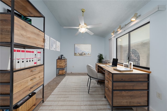 home office with tile patterned flooring and a ceiling fan
