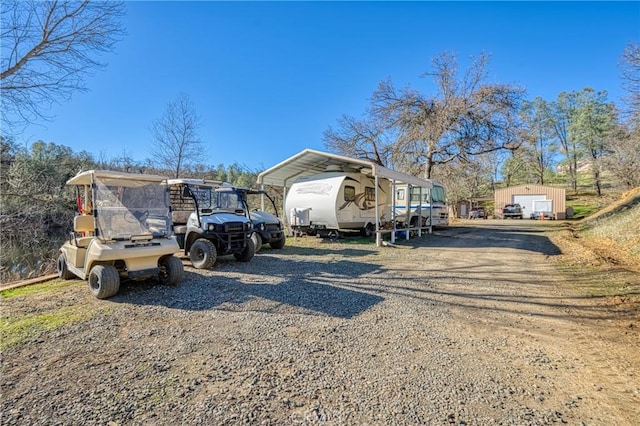 exterior space with an outbuilding and a carport