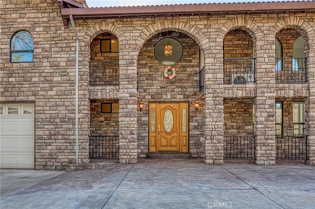 doorway to property featuring stone siding