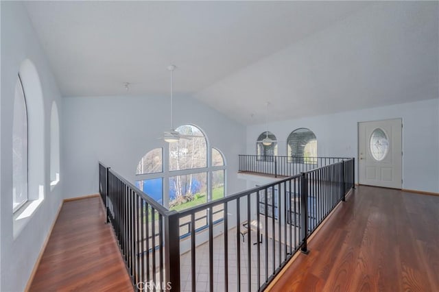 15796 Joseph Trl, Lower Lake, CA 95457 - hallway with plenty of natural light, vaulted ceiling, wood finished floors, and an upstairs landing