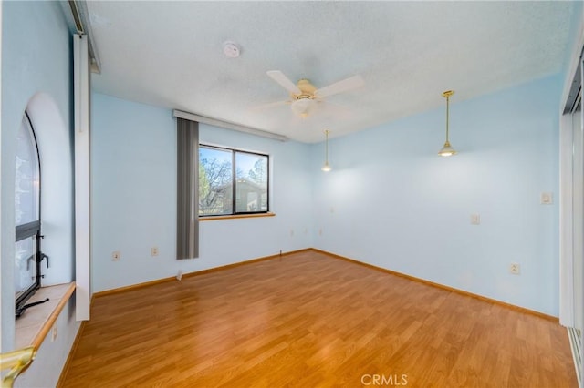 15796 Joseph Trl, Lower Lake, CA 95457 - empty room featuring light wood-type flooring, a ceiling fan, and a textured ceiling