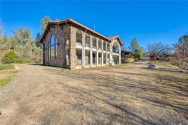 view of property exterior with a balcony