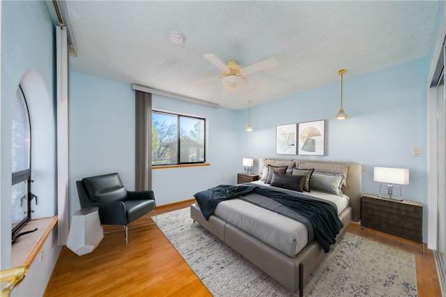 bedroom with ceiling fan and light wood finished floors