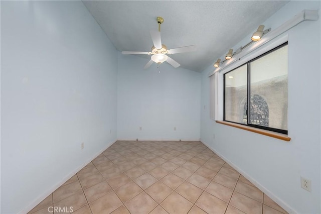 spare room with a ceiling fan