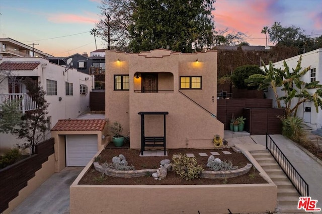 view of front of home with a garage