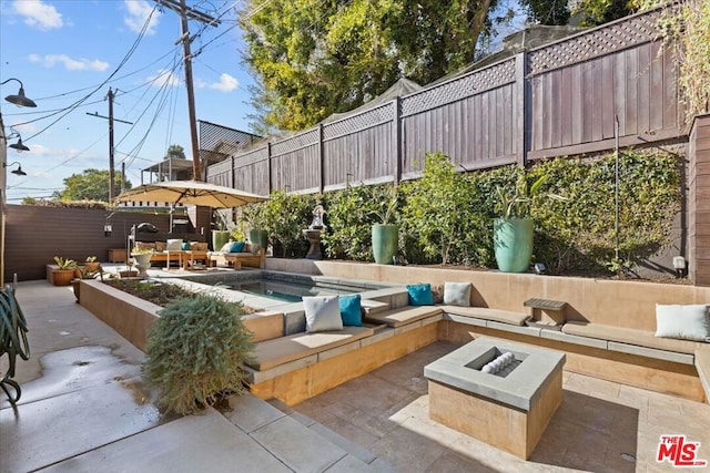 view of patio with a fire pit