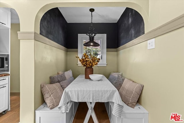 dining space with light hardwood / wood-style flooring