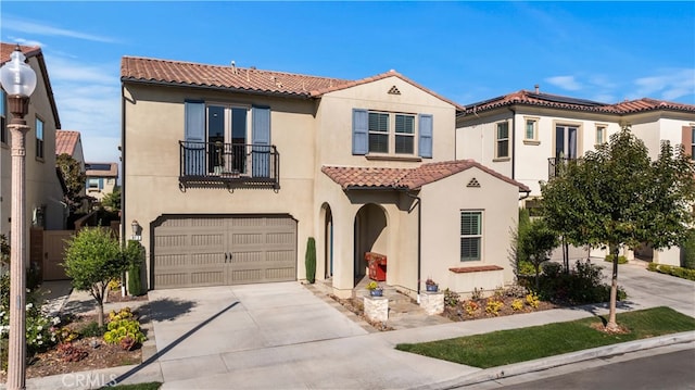 mediterranean / spanish-style home with a garage