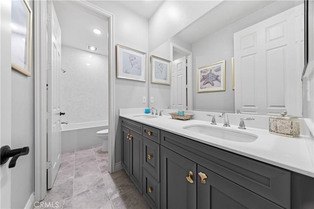 full bathroom featuring shower / bathtub combination, vanity, and toilet