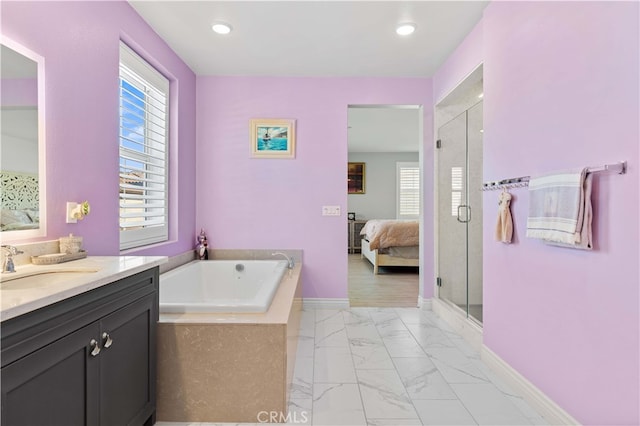 bathroom featuring vanity and separate shower and tub